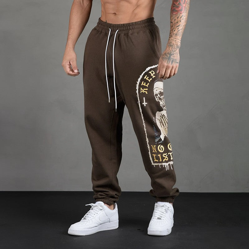 KEEP PRAYING NO ONE IS LISTENING Skull GRAPHIC PRINT JOGGERS