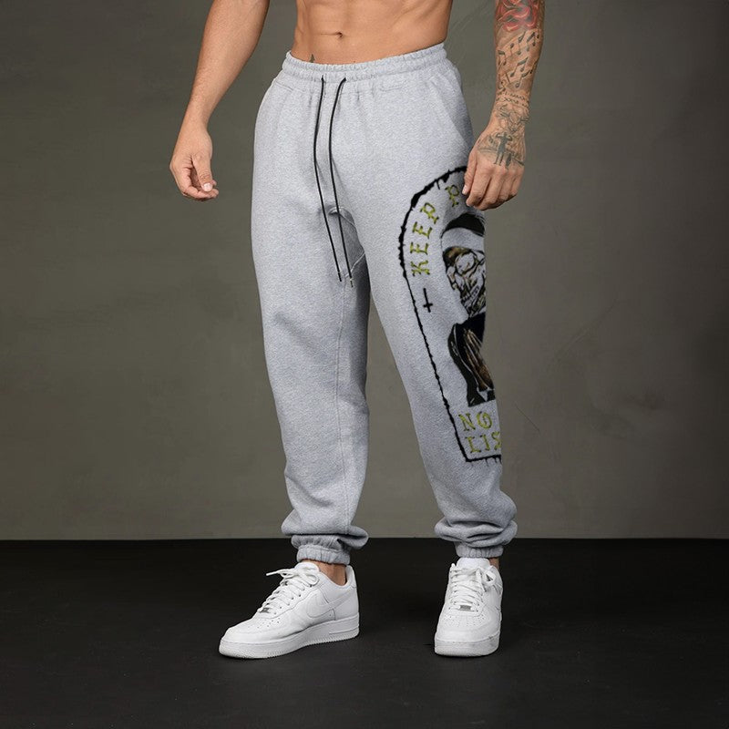 KEEP PRAYING NO ONE IS LISTENING Skull GRAPHIC PRINT JOGGERS