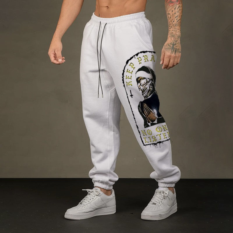 KEEP PRAYING NO ONE IS LISTENING Skull GRAPHIC PRINT JOGGERS