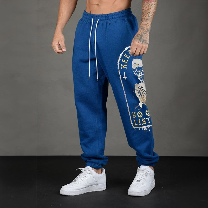 KEEP PRAYING NO ONE IS LISTENING Skull GRAPHIC PRINT JOGGERS