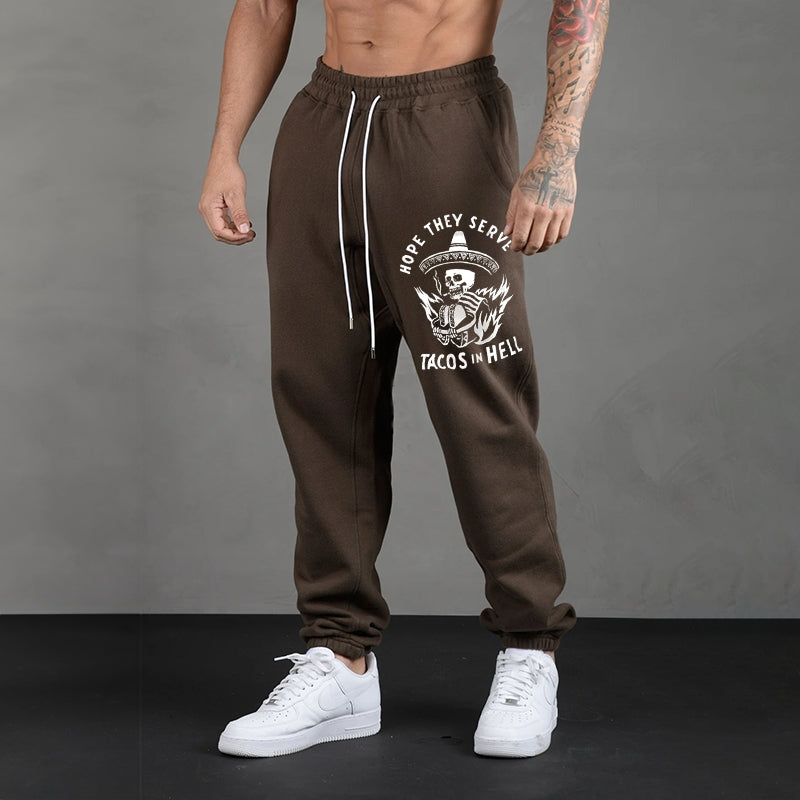 HOPE THEY SERVE TACOS IN HELL SMOKING SKULL GRAPHIC PRINT JOGGERS