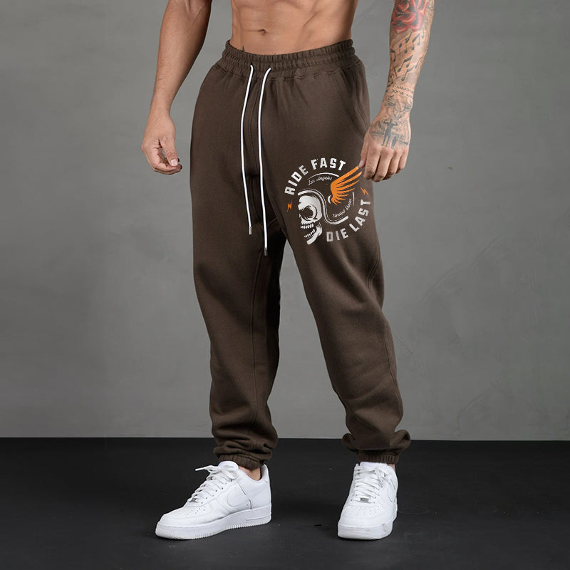 RIDE FAST DIE LAST CRAZY SKULL WITH A WINGS HELMET GRAPHIC PRINT JOGGERS